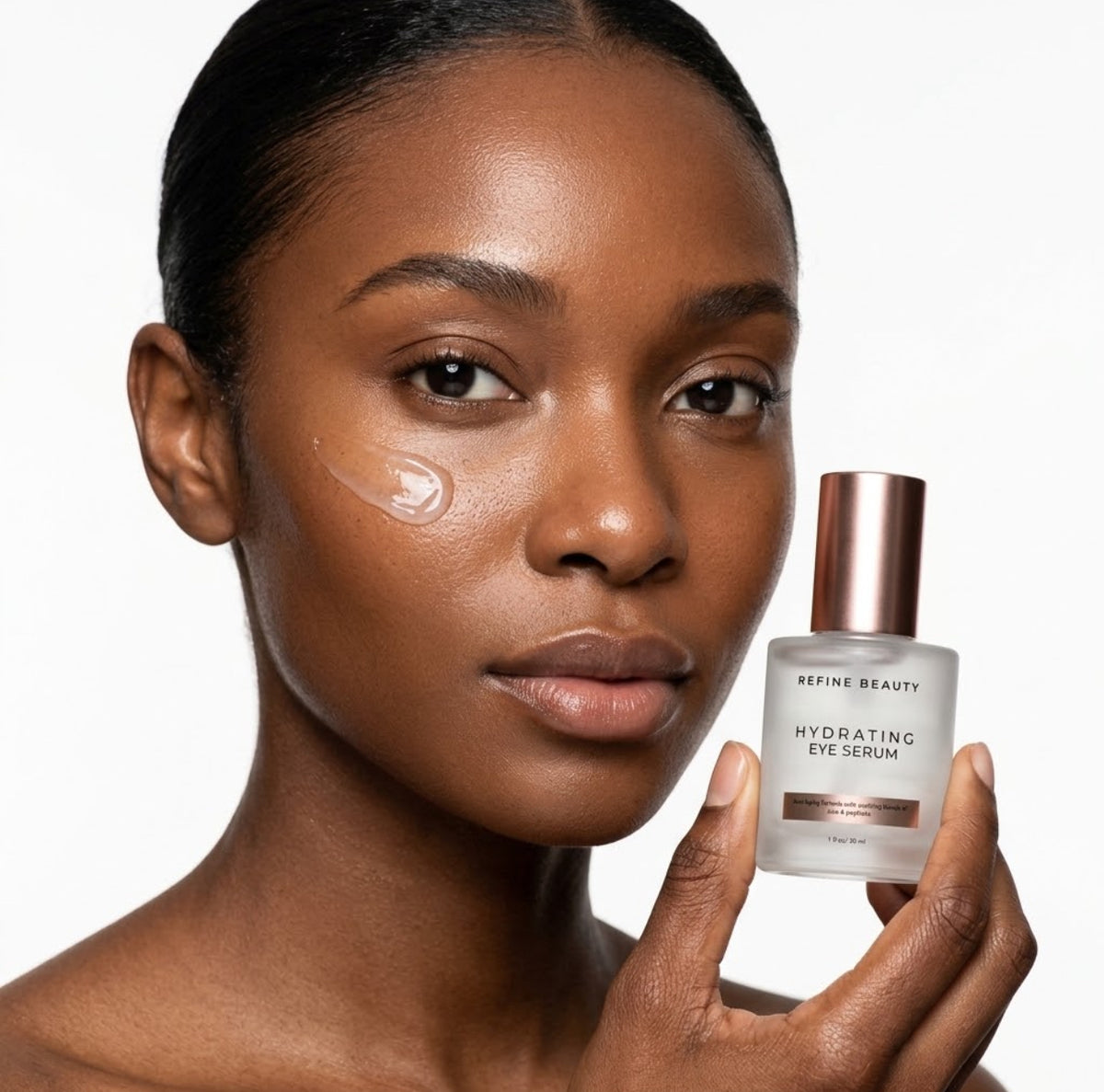 Model holding Refine Beauty Hydrating Eye Serum with clear gel swatch on white background