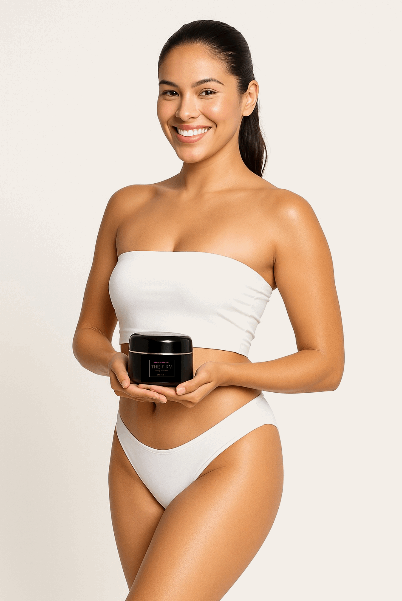 Model wearing white holding Refine Beauty The FIRM BodyCream