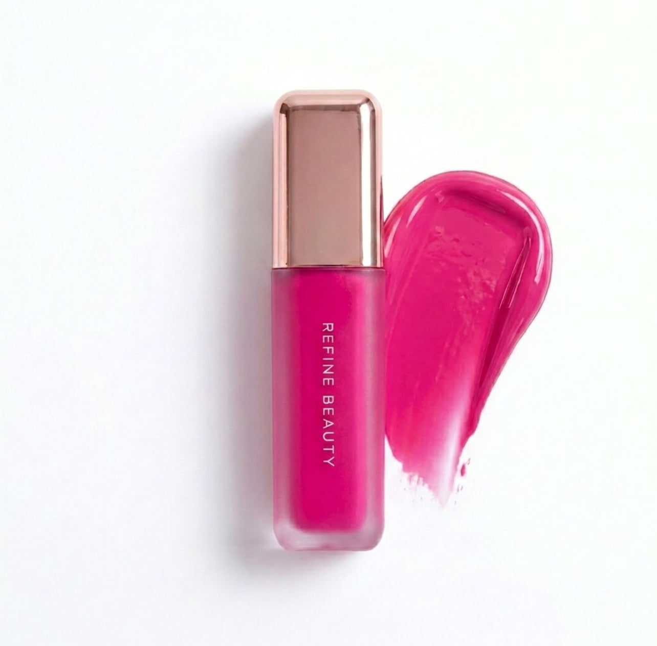 Refine Beauty blush with rose gold cap on a white background