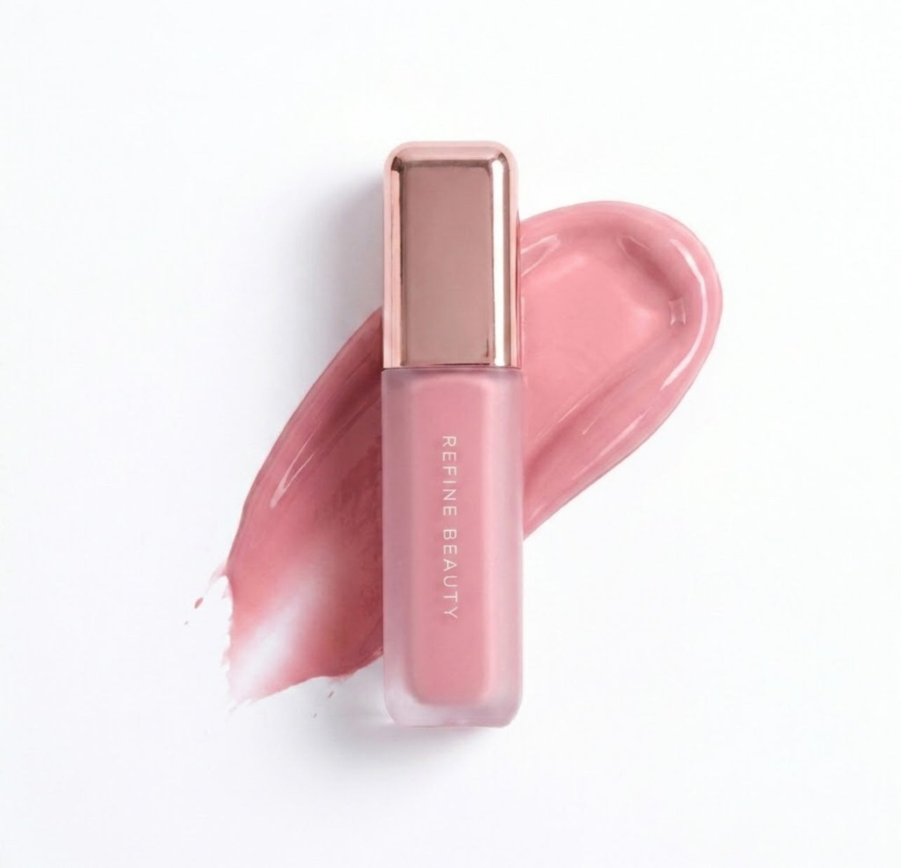 Refine Beauty blush with rose gold cap on a white background