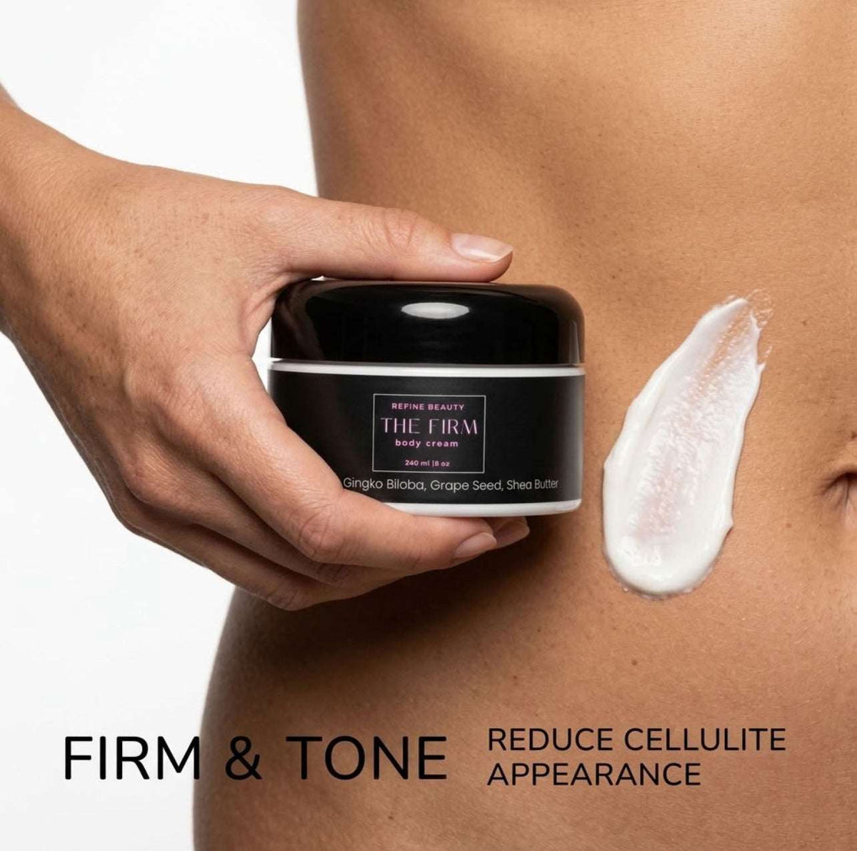 A person's hand holds a black jar of Refine Beauty The Firm body cream next to a smear of white cream on bare skin, with text reading 'FIRM & TONE REDUCE CELLULITE APPEARANCE'.