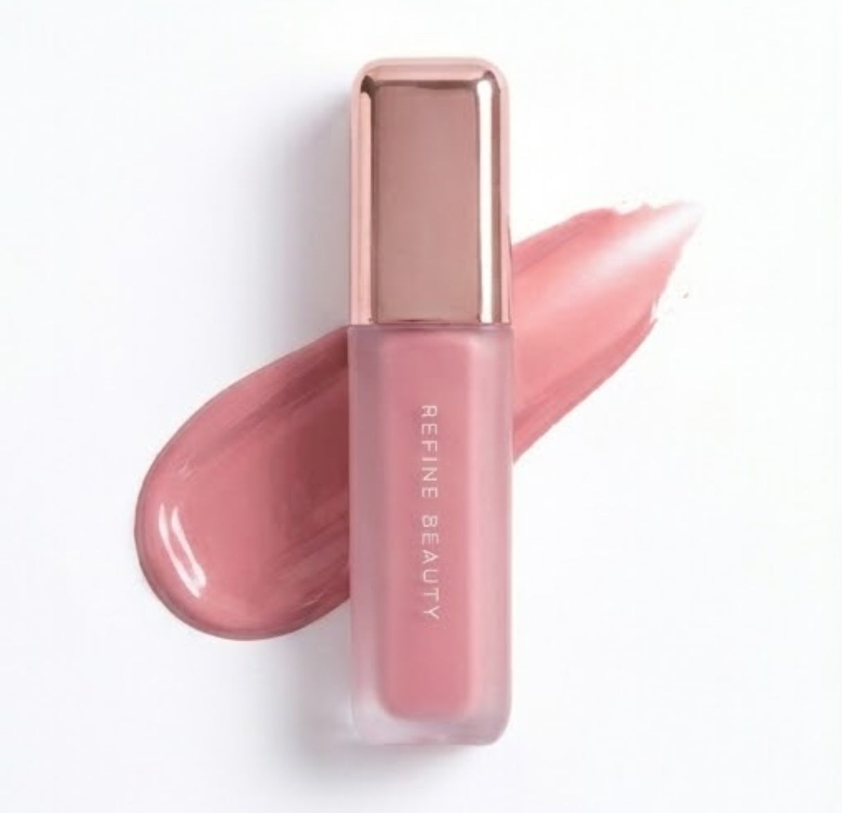 Refine Beauty blush with rose gold cap on a white background on a white background