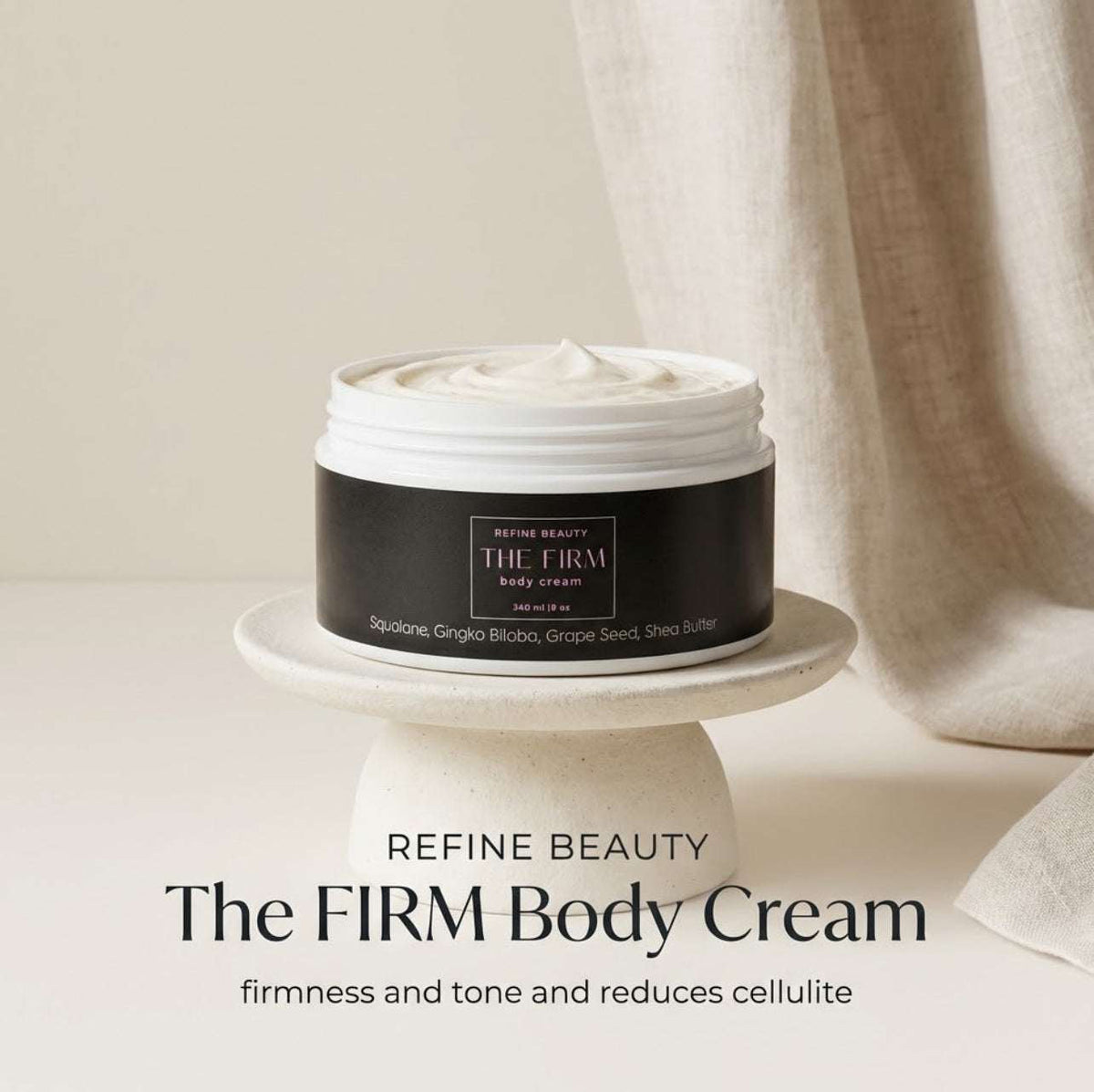 Jar of Refine Beauty The Firm Body Cream on a white pedestal with a neutral background