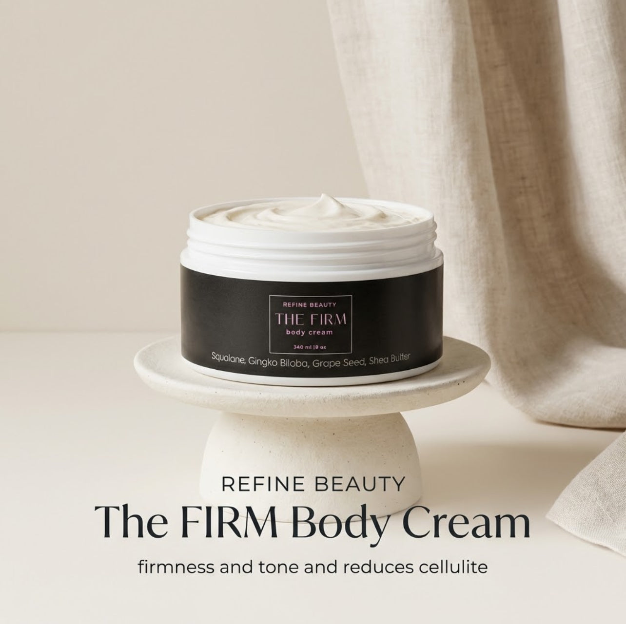 Jar of Refine Beauty The Firm Body Cream on a white pedestal with a neutral background