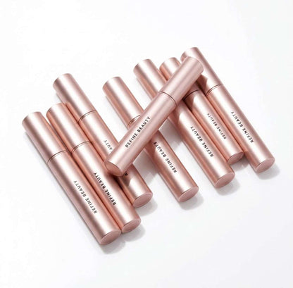 Refine Beauty Volume mascaras tubes on white background 