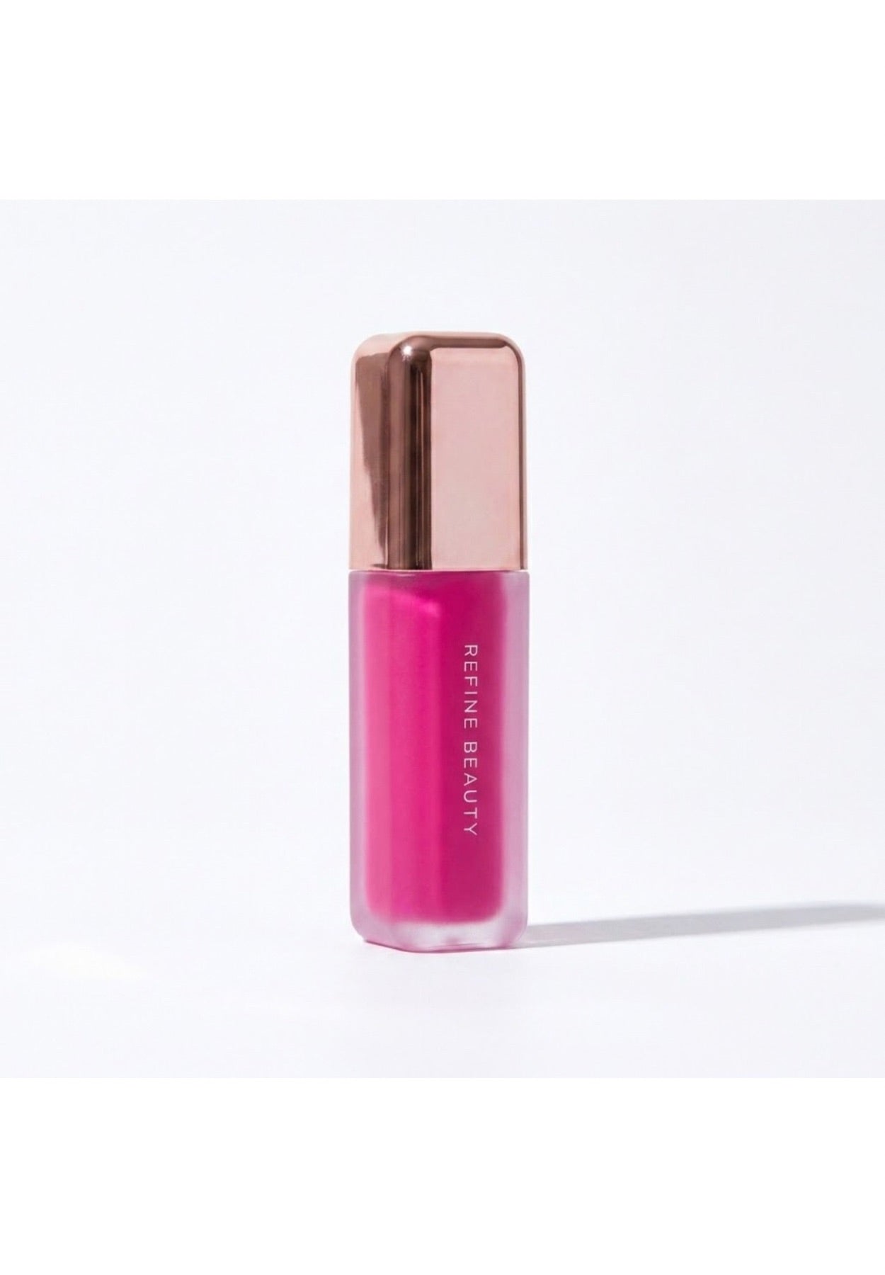 Refine Beauty blush with rose gold cap on a white background