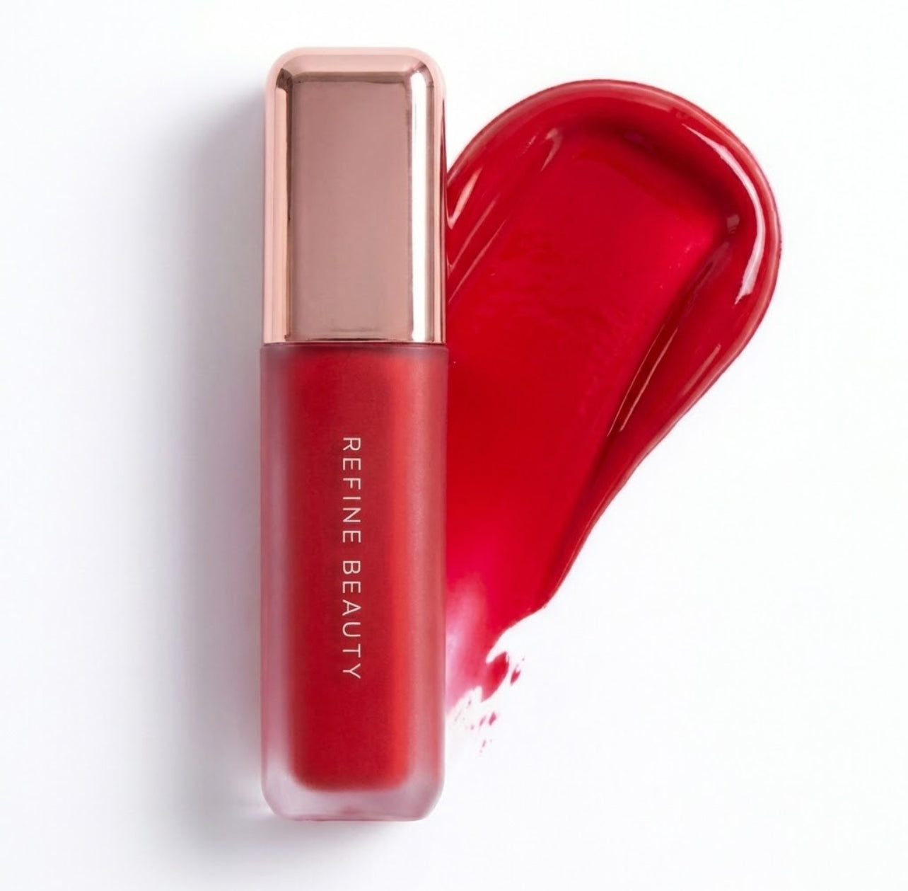 Refine Beauty blush with rose gold cap on a white background 