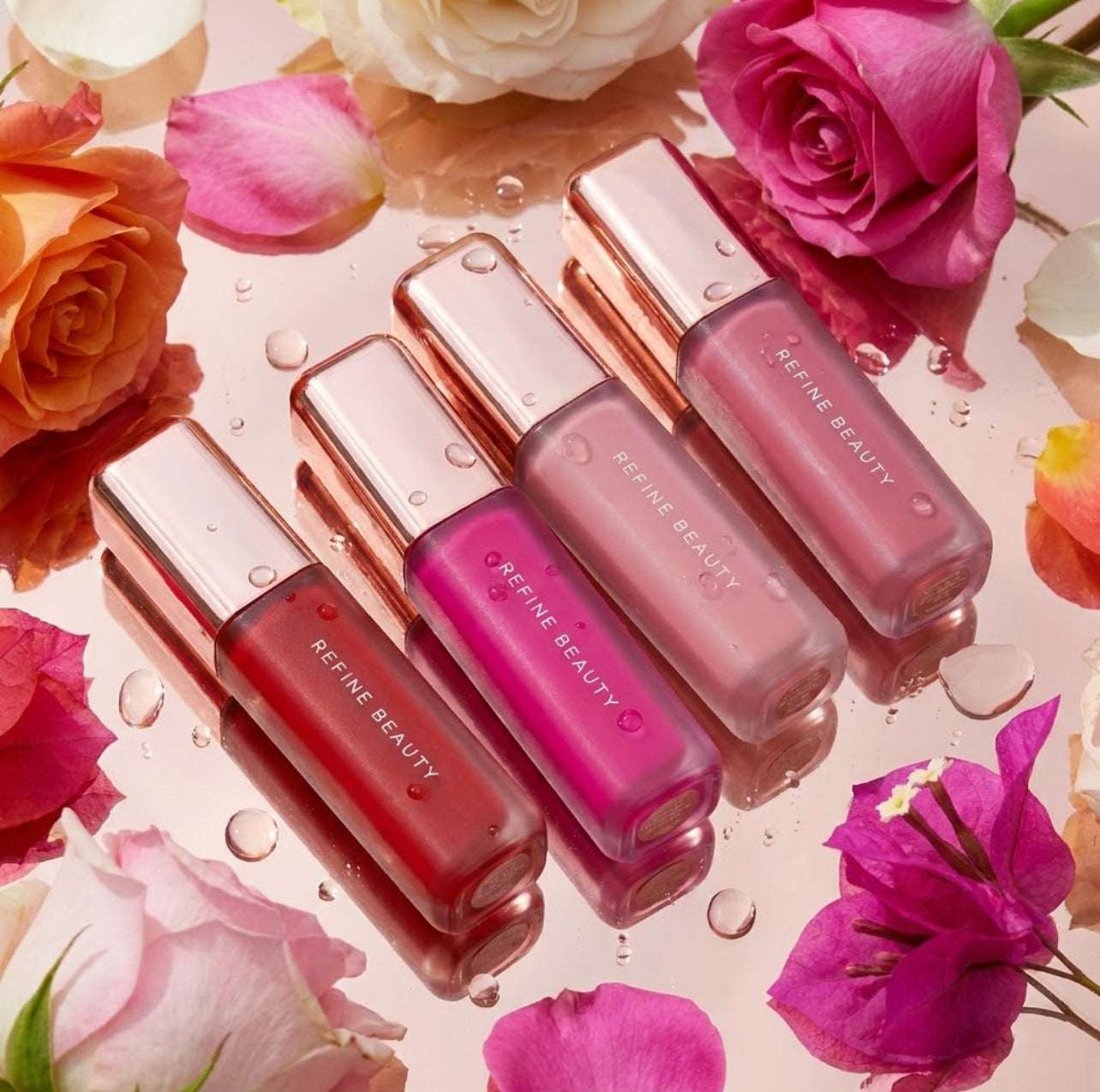 Set of Refine Beauty blush on a floral background