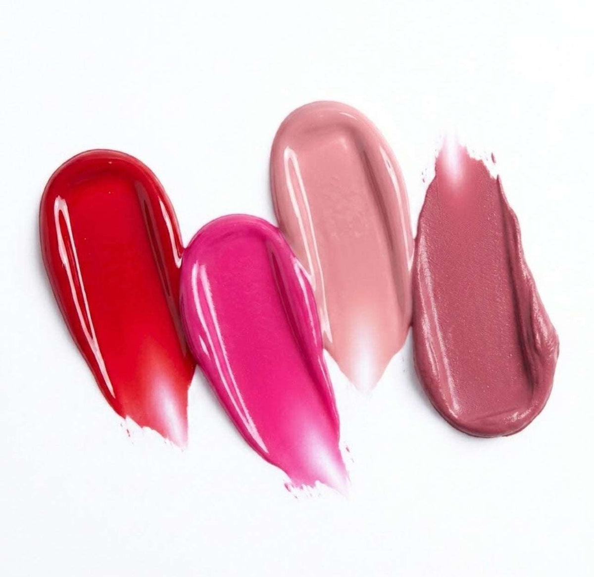 Four swatches of different Refine Beauty blush on a white background on a white background