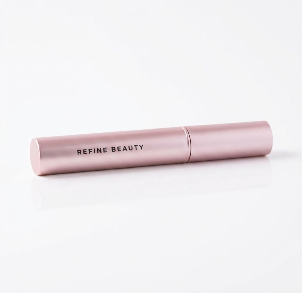 Refine Beauty Volume mascara on a light gray background