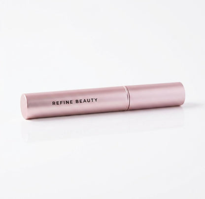 Refine Beauty Volume mascara on a light gray background