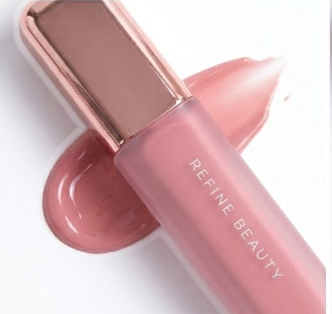 Refine Beauty blush with rose gold cap on a white background