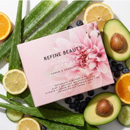 Refine Beauty hydration Glow set packaging surrounded by fruits and vegetables on a white background