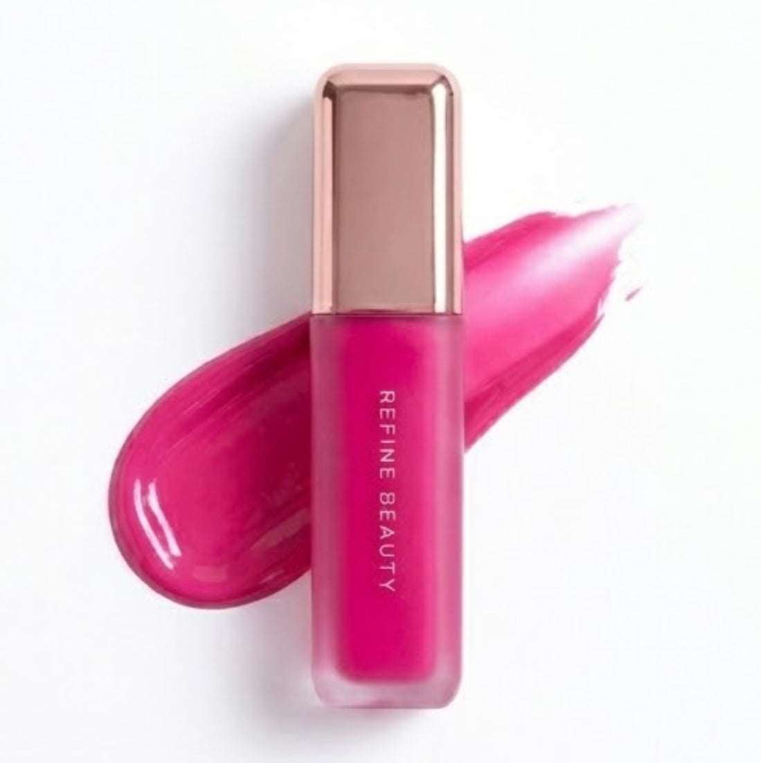 Refine Beauty blush with rose gold cap on a white background with rose gold cap on a white background