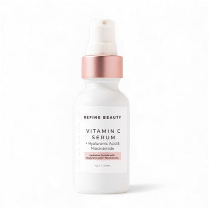 Refine Beauty Vitamin C serum bottle with rose gold cap on a white background