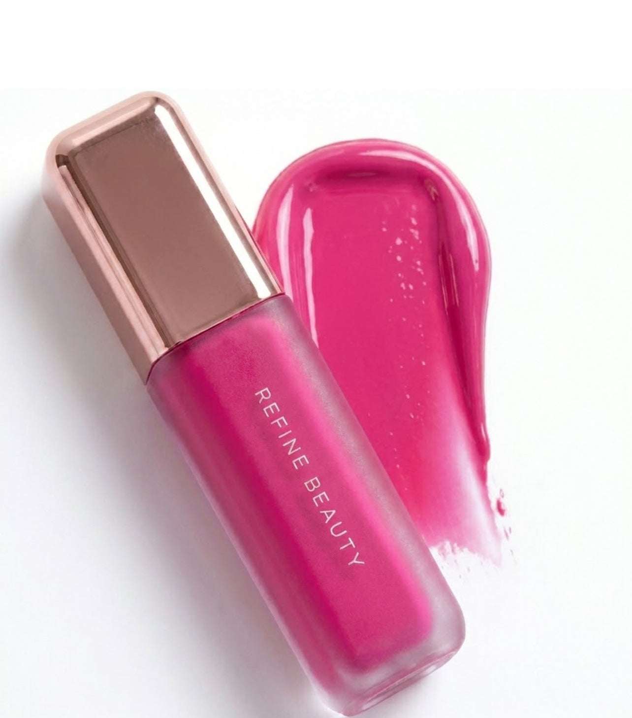 Refine Beauty blush with rose gold cap on a white background