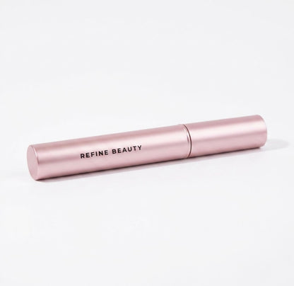 Refine Beauty Volume mascara on a light gray background