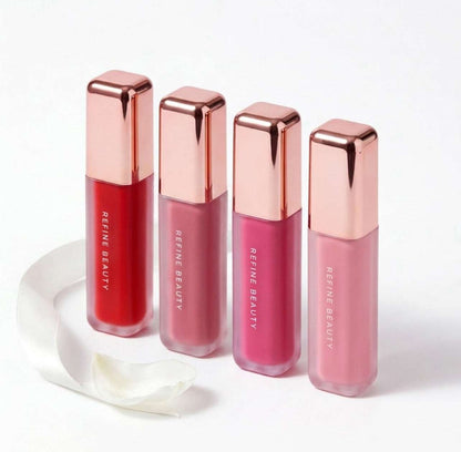 Refine Beauty blush with rose gold caps on a white background